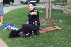 Cpl. David Eric Casebolt restraining a 15-year-old girl outside a community pool in McKinney, Texas.